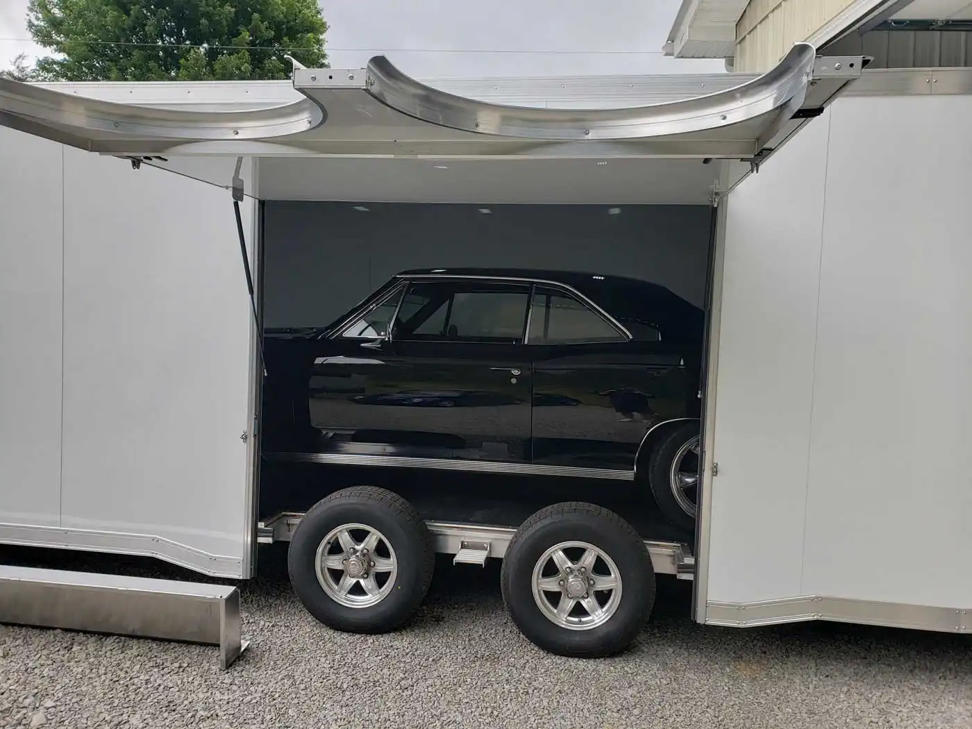 Classic vehicle inside an enclosed trailer
